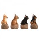 Kövön ülő ugató kiskutya polyresin szobor